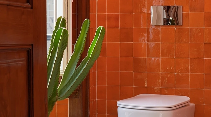 Pared de azulejos de Zellige baño naranjas